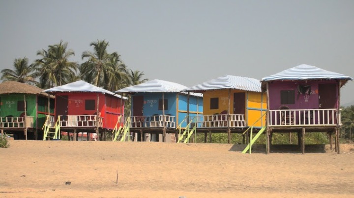 Colorful beach huts on the beach in Goa